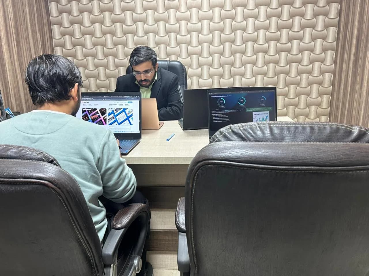 Dzentra team members collaborating on innovative digital solutions in a modern office environment